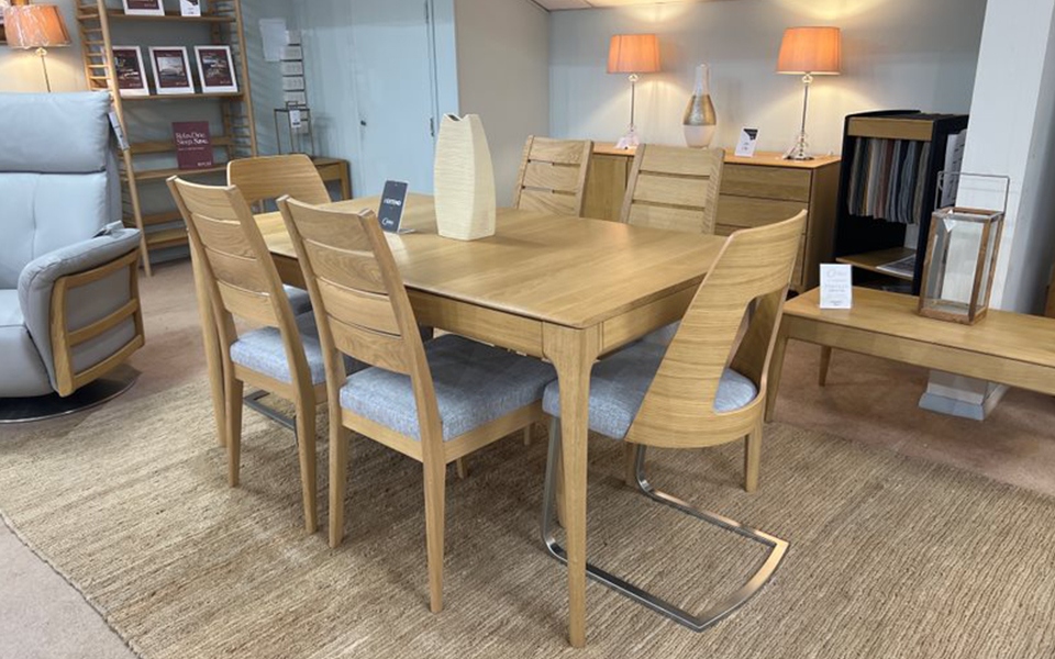 Ercol Romana Extending Dining Table & 6 Chairs
Solid Oak, Clear Matt Oak Finish, Chairs in Fabric C712
W:155/200cm D:90cm H:75cm
Was £5,157 Now £3,399